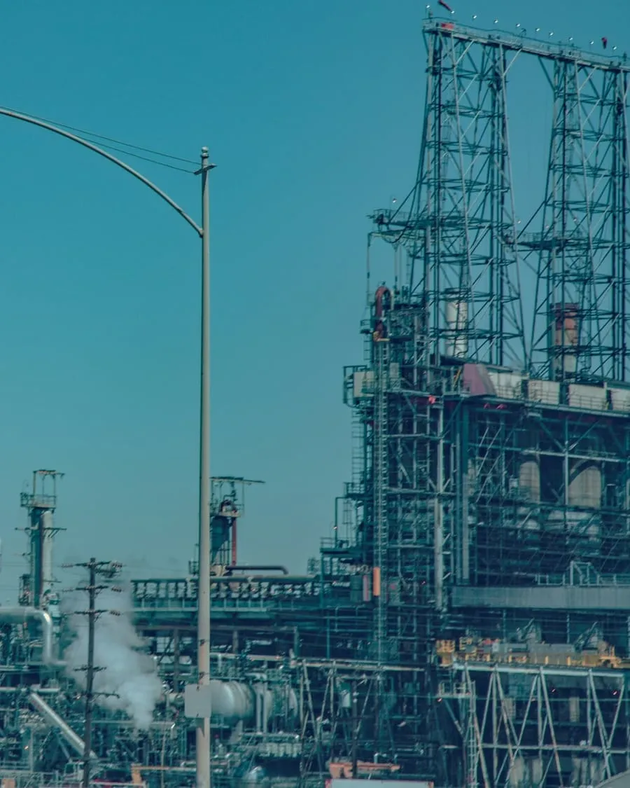 Process towers and pipe rack at a refinery.