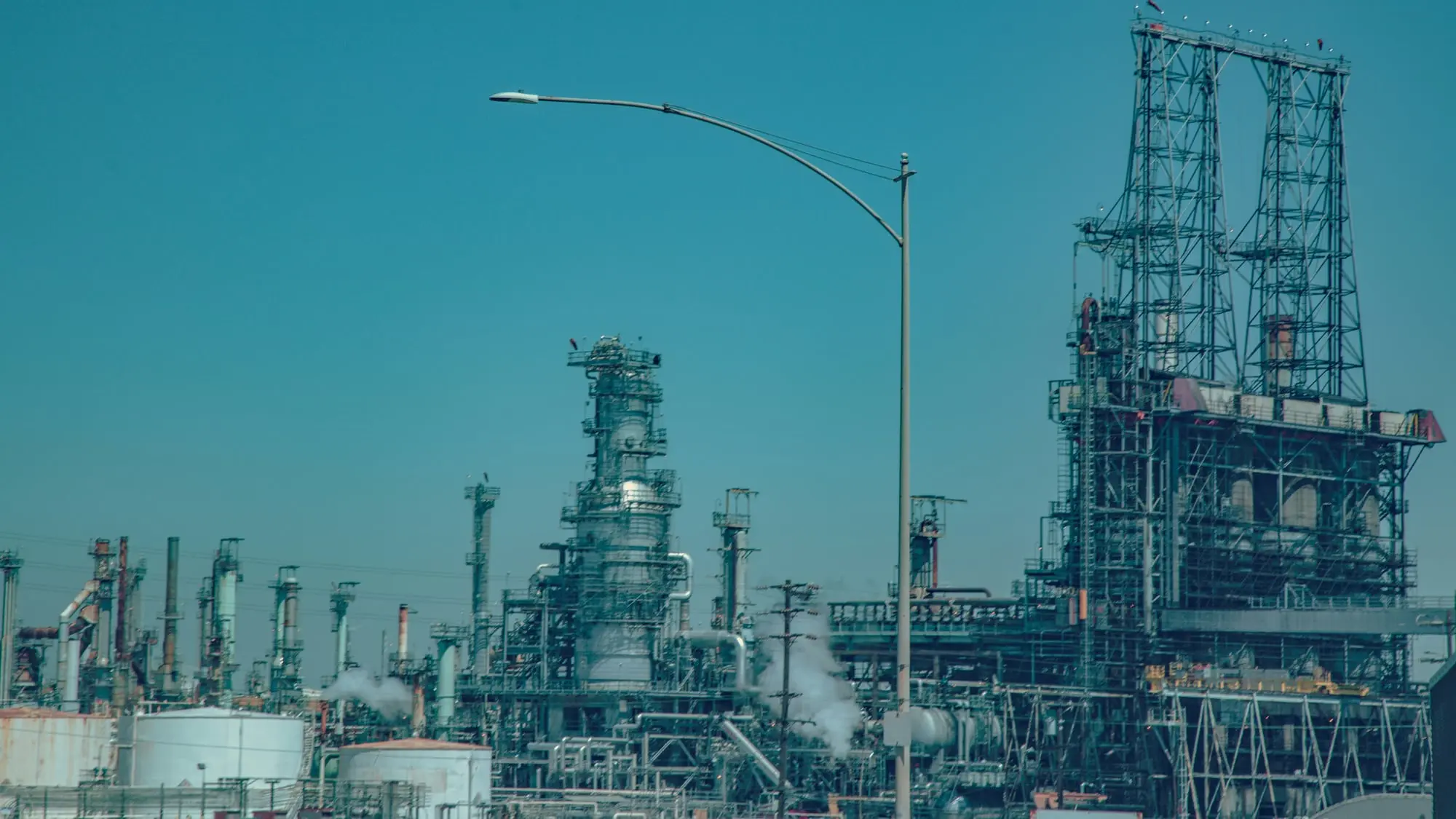 A refinery seen through process pipework